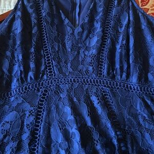 Beautiful lacy Navy Blue sleeveless dress & zippered closure in back.